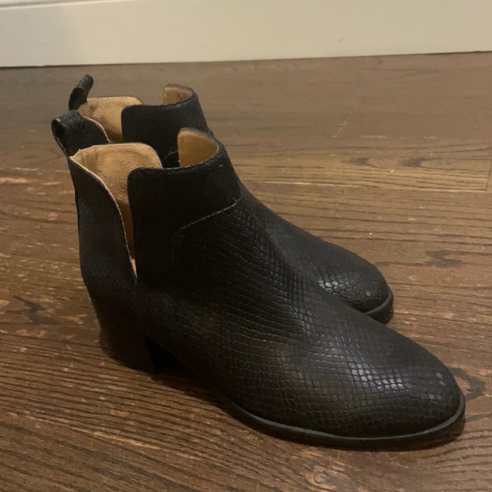 Woman’s black low heel booties